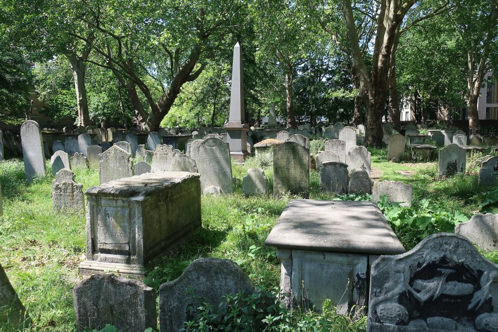A historic cemetery path through Bunhill Fields representing the records inside rejected registers.