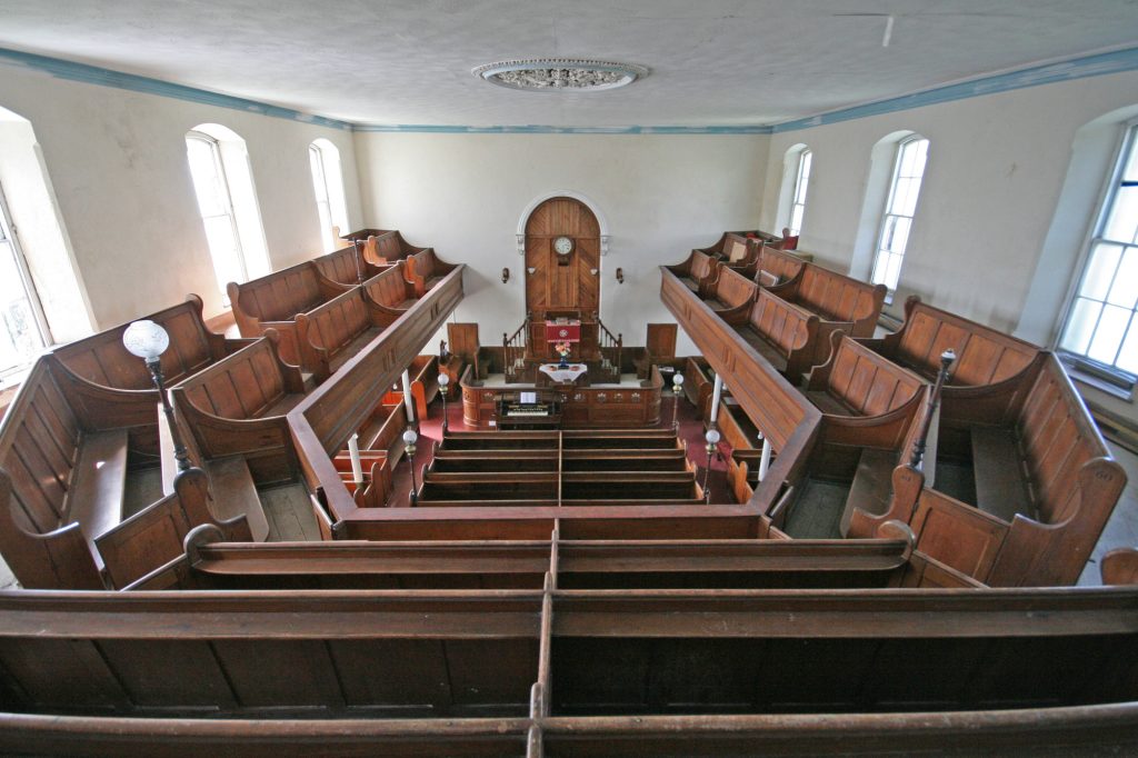 A historical chapel interior representing the places of worship for nonconformist ancestors.