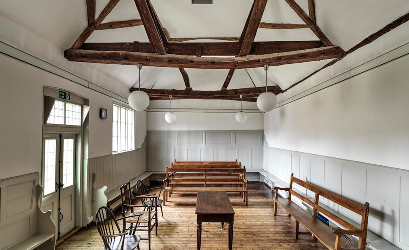 A historic Friends meeting house representing the community locations behind early Quaker records.