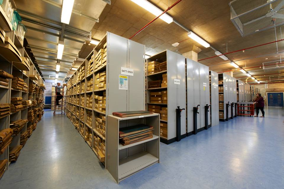 Archival boxes holding local rate books and trade directories used as a missing census substitute.