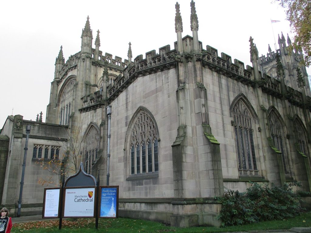 The historic exterior of Manchester Cathedral representing the Mother Church records found in Lancashire parish registers.